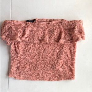 A pink foral off the shoulder shirt